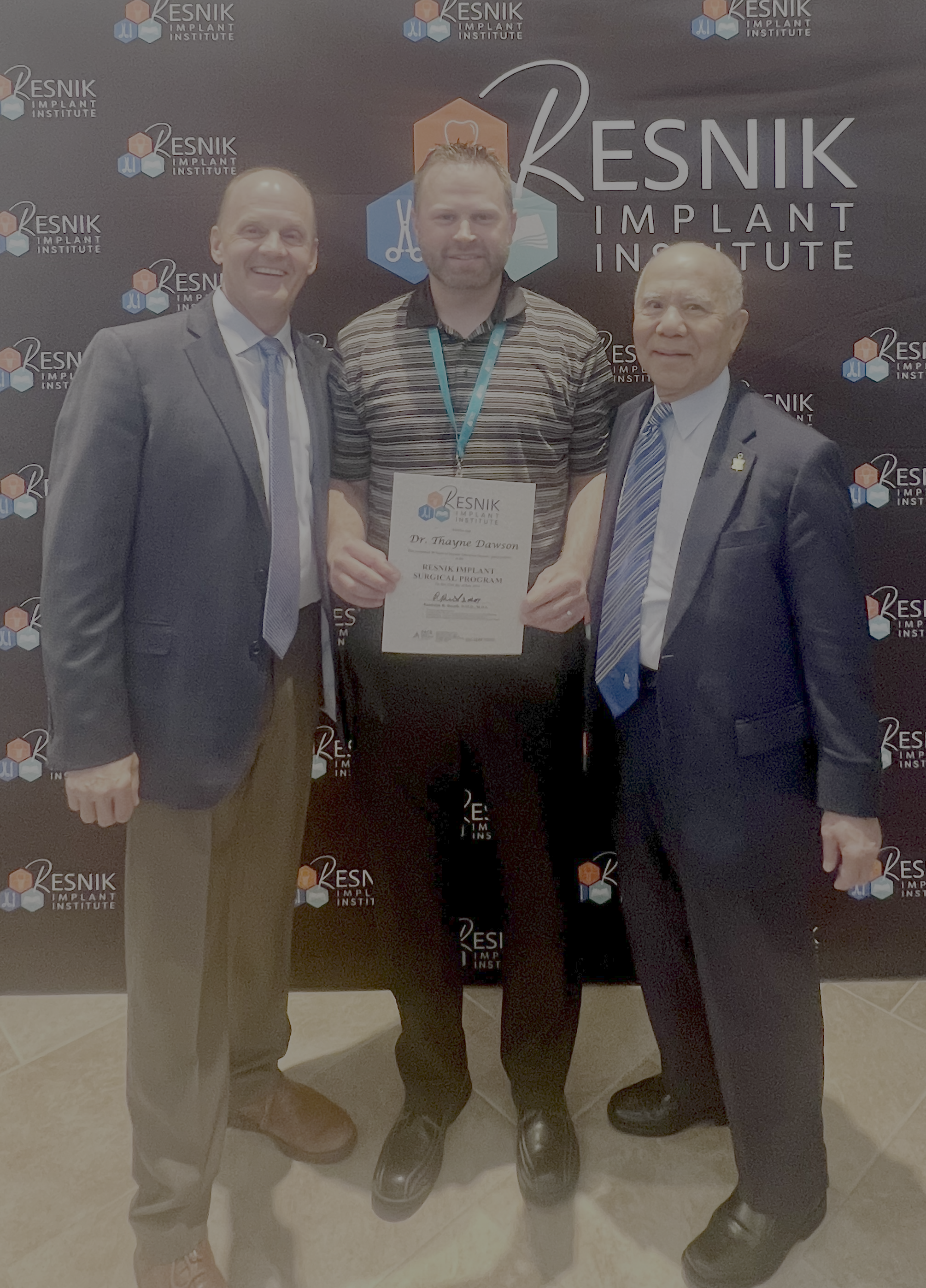 Dr. Dawson receiving from Resnik Implant Institute with Dr. Randy Resnik and Dr. Jon Suzuki